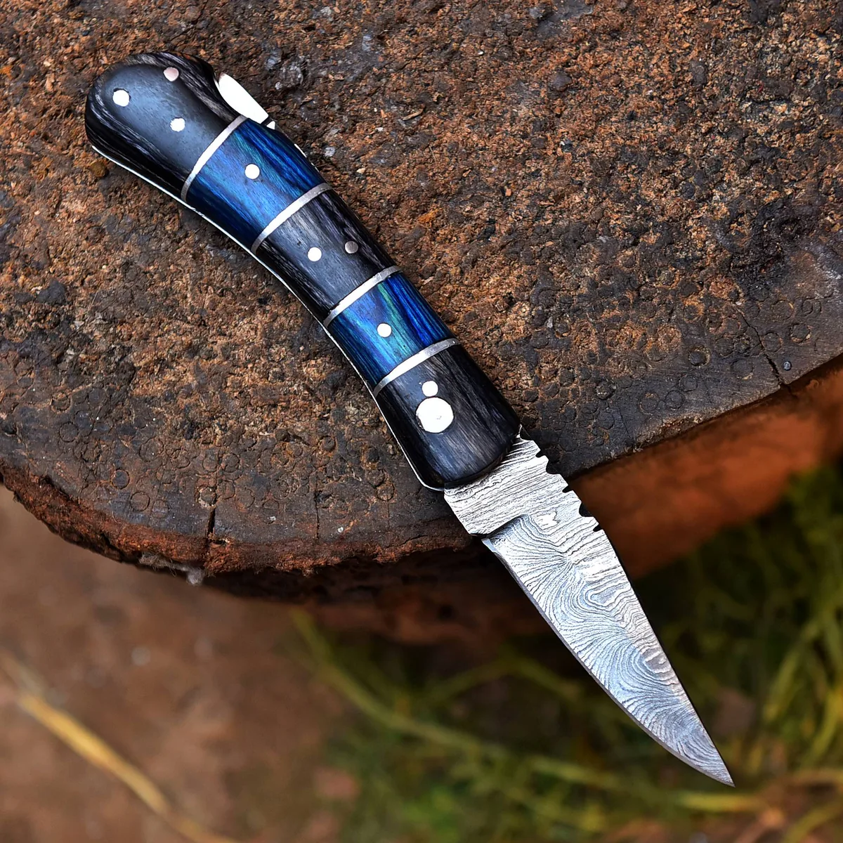 RIA-385 Handcrafted Damascus Steel Folding Knife With Intricately Designed Blue Resin and Wood Handle – Perfect for Collectors & Outdoor Enthusiasts
